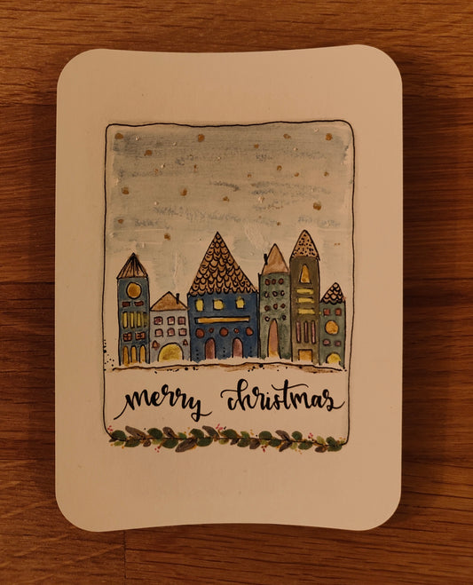Weihnachtskarte „Merry Christmas“ – handgezeichnete Winterstadt mit Häusern